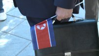 Дариха Сотир Цацаров със знаме на КНДР